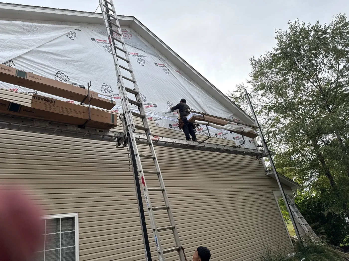 Siding installation documented in Imperial Hills